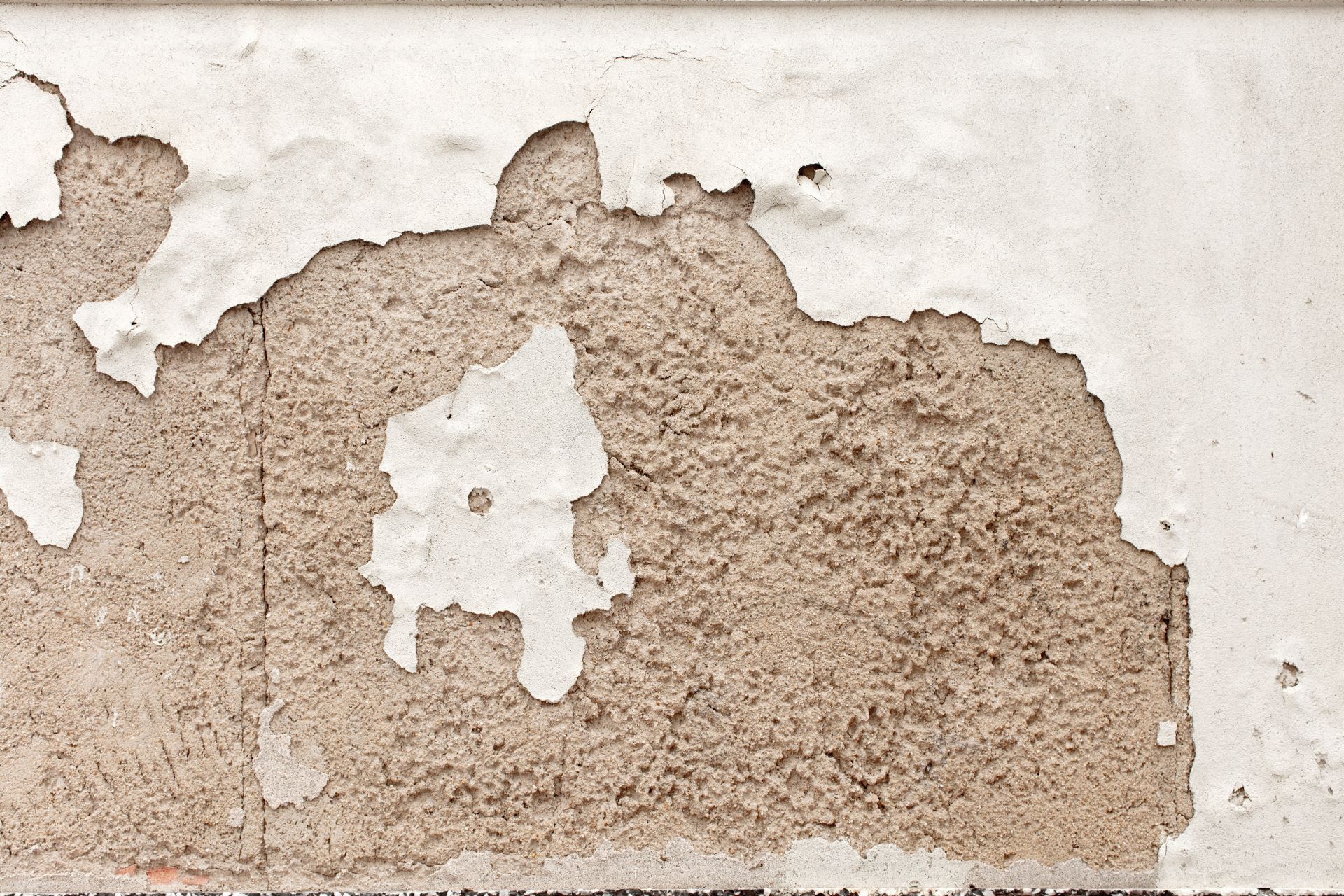 Repairing Exterior Cement Plaster Chips in Coastal Walls